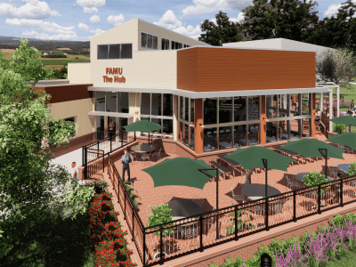 Rendering of a two-story building labeled "FAMU The Hub" with outdoor patio seating, green umbrellas, and landscaped surroundings.