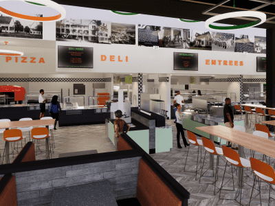 A modern cafeteria with multiple food stations labeled pizza, deli, entrees, and grill. People are sitting and ordering food. The space has orange chairs and black-and-white decor accents.