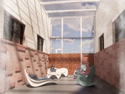 Four people sit and converse on modern chairs in a narrow, open-roofed courtyard with brick and concrete walls under a partly cloudy sky.