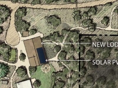 A site plan illustration showing the new Camp Colton Lodge and PV System, both labeled with arrows, nestled among trees and pathways.